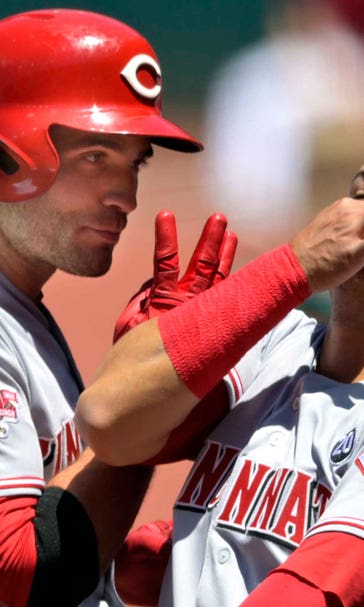 Reds open game with 2 homers, beat Indians 7-2, split series